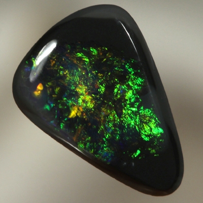 SOLID BLACK OPAL Burning copper orange contrasted by bottle green, always sparkling